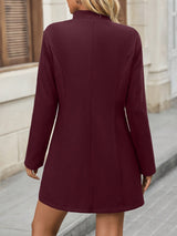 Manteau élégant à col droit et boutons classiques