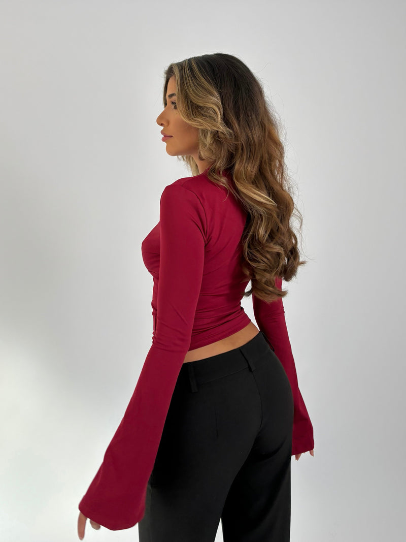 Vue arrière du haut rouge extensible à manches longues – Nordique Chic