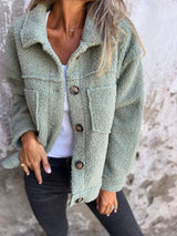 Veste boutonnée en maille douce avec poches plaquées