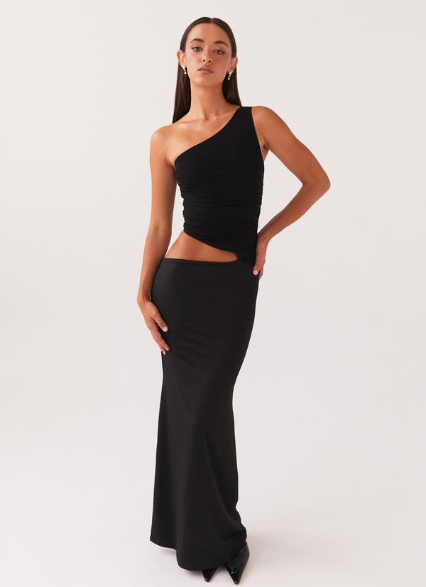Robe longue noire asymétrique femme, vue de face élégante