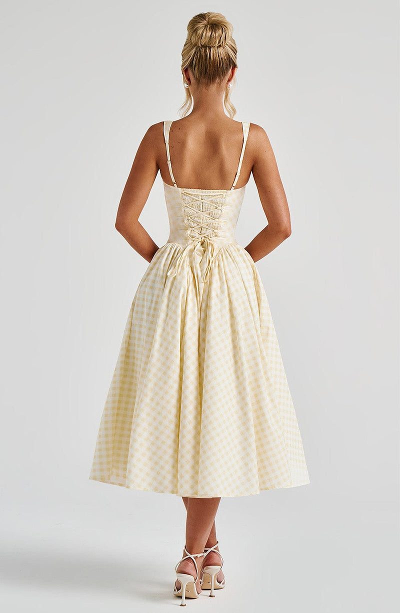 Vue trois-quarts de la robe midi jaune – jupe volumineuse