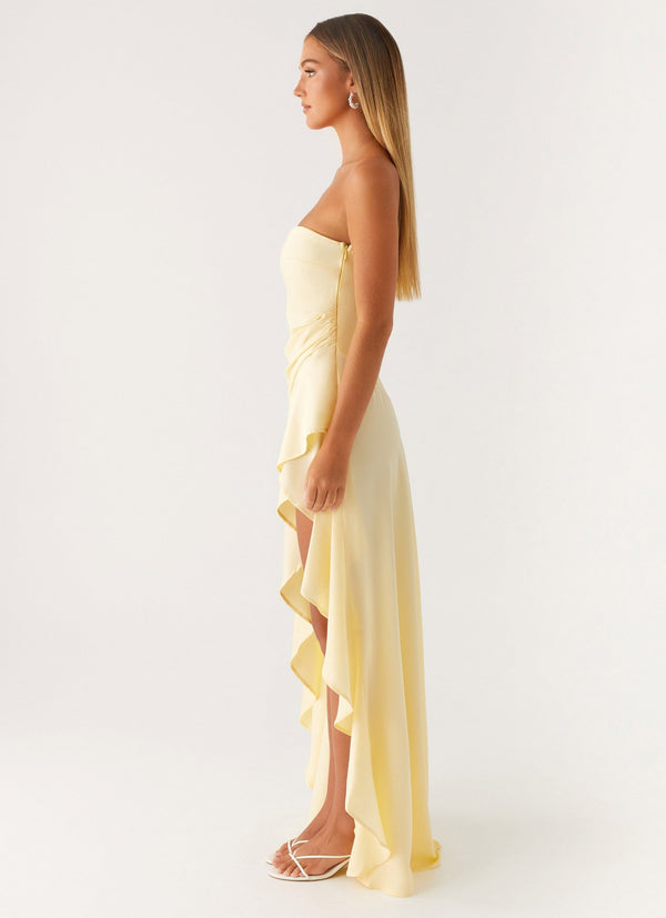 Vue de profil de la robe bustier longue jaune pâle asymétrique
